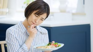 Asian,Woman,Worried,About,Eating